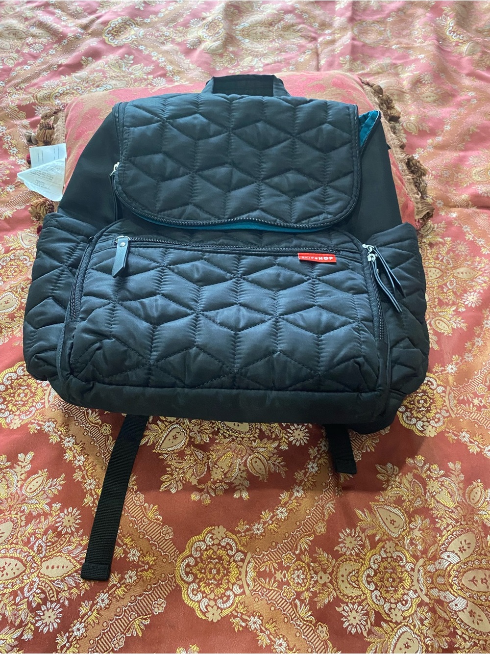 Skip Hop Black Quilted Backpack with Teal Trim for newborn baby stuff to carry.